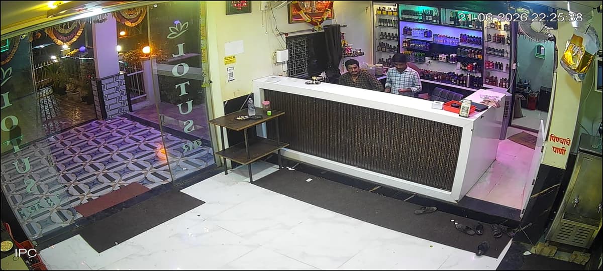 Lotus bar counter with stocked shelves and reception area