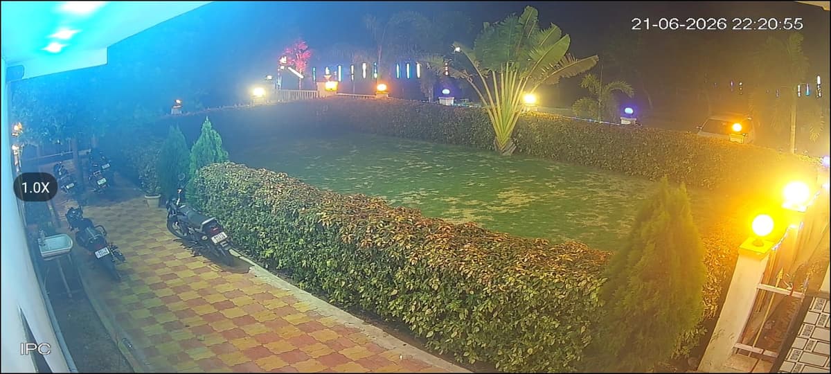 Outdoor garden lawn and seating area at Lotus Family Restaurant